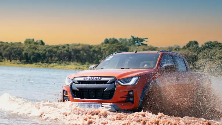 isuzu d-max driving through muddy water
