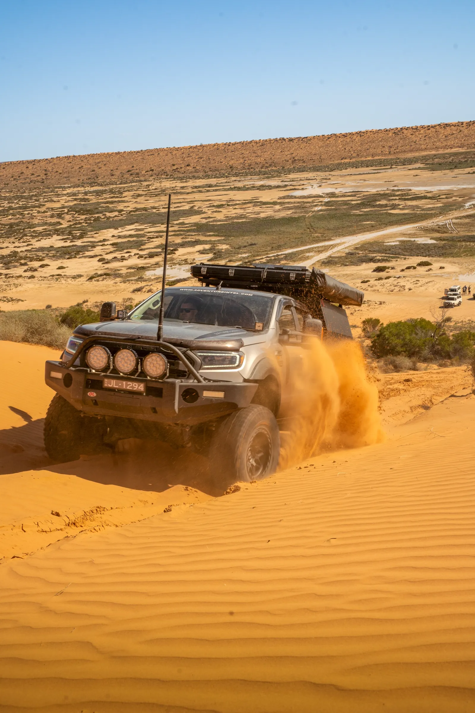 4x4 driving through sand dune