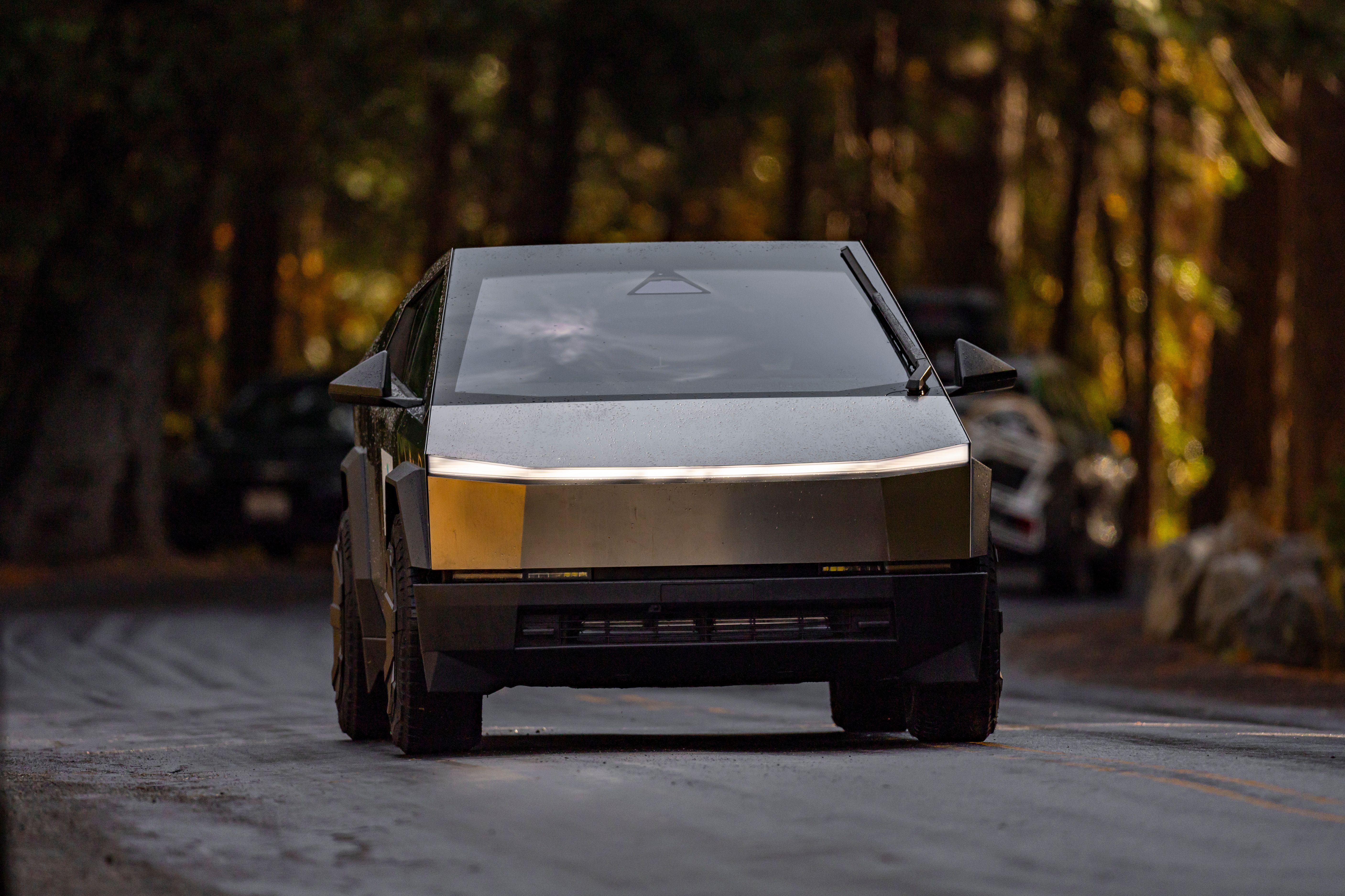 A Tesla Cybertruck on a dirt road