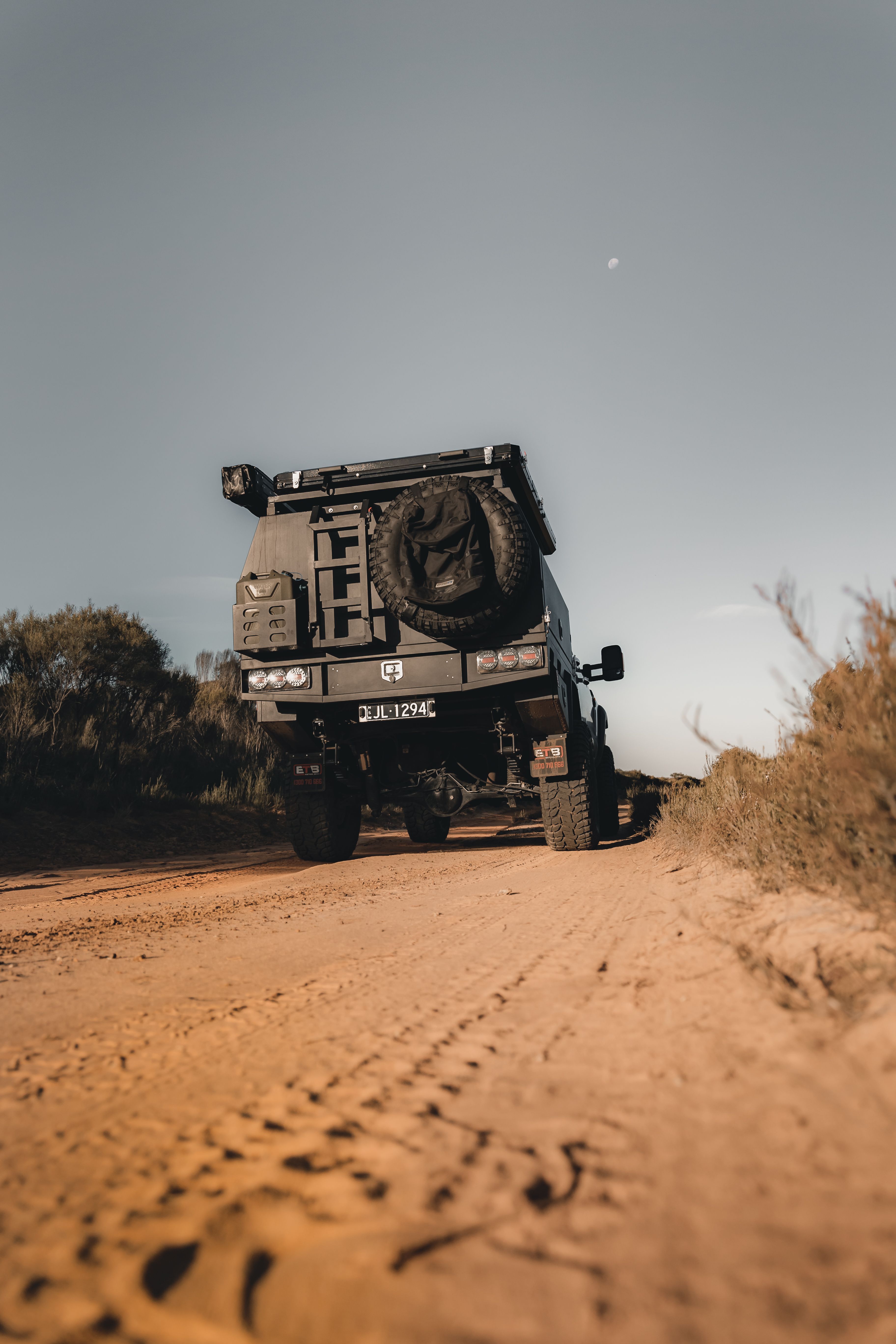 The behind of a 4X4 Ford Ranger on a sandy track in Big Desert, Victoria
