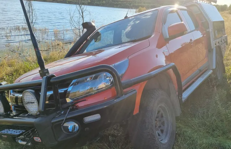 THE VEHICLE BOGGED BY THE RIVERS EDGE