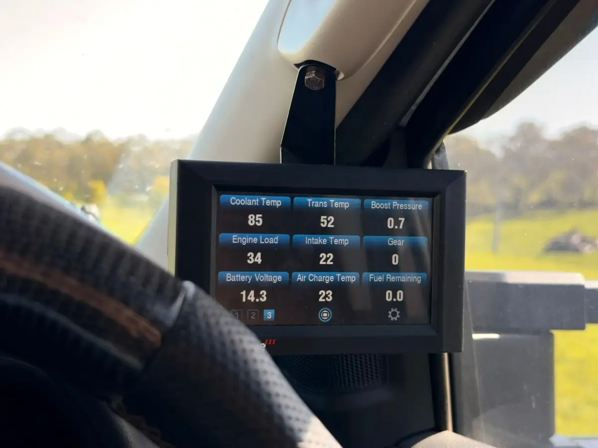 gauge inside of a vehicle displaying various readings and temperatures