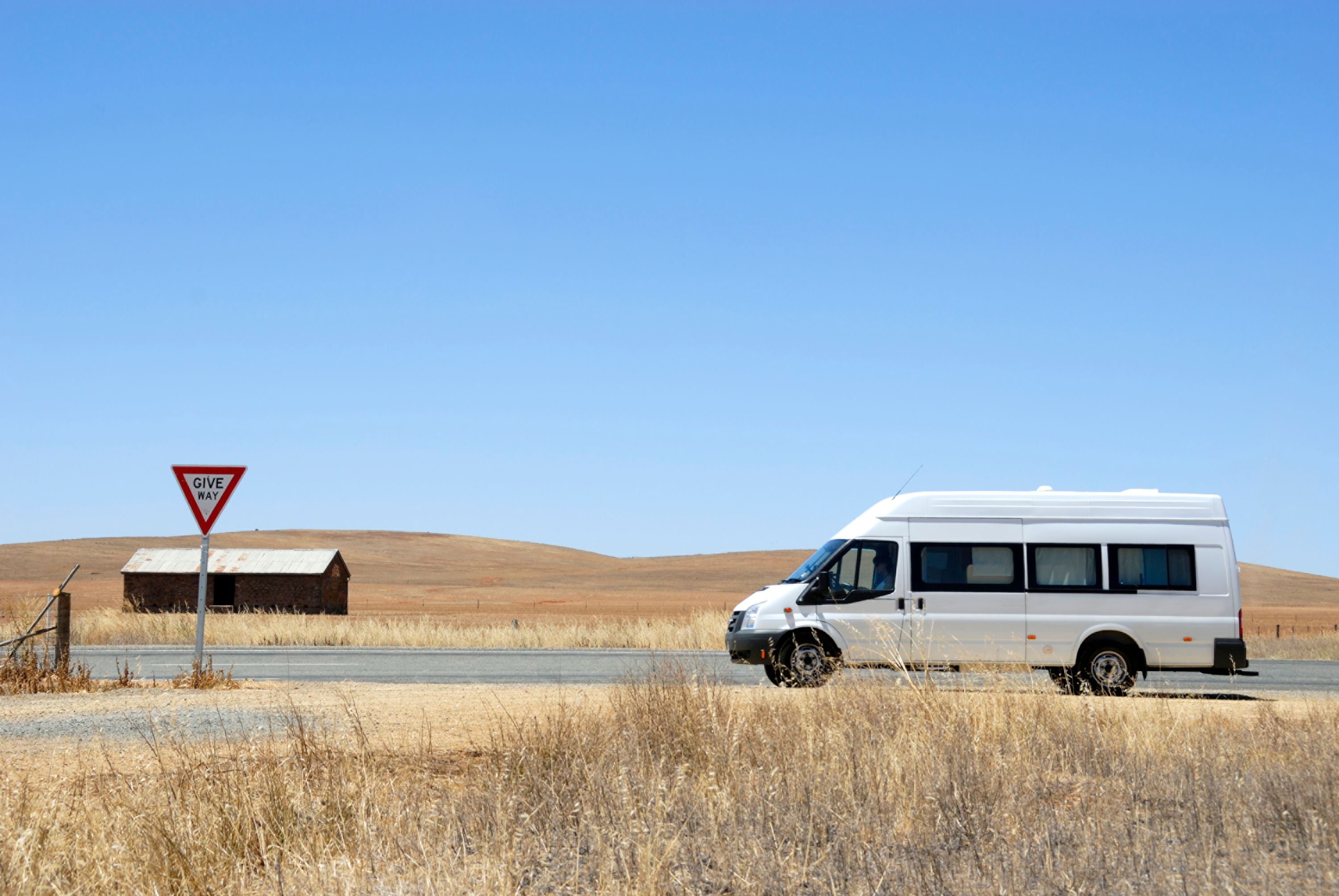 Camper van on its way in the desert in Australia