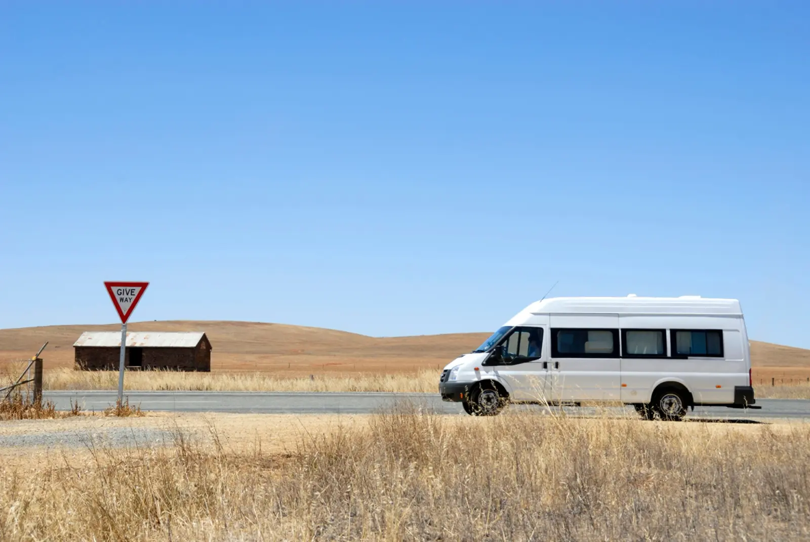 Camper van on its way in the desert in Australia