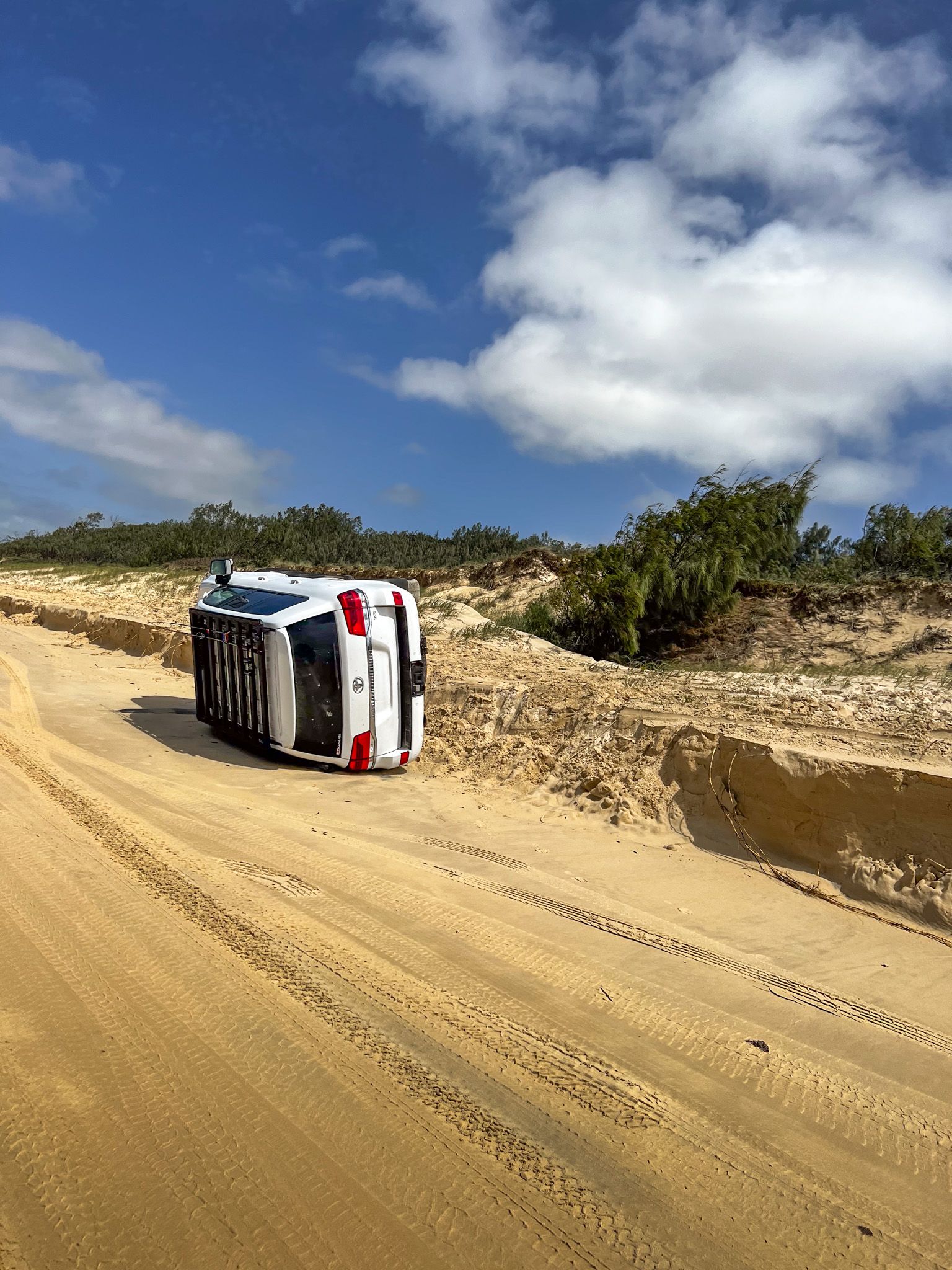 A 4X4 Toyota LandCruiser rolled over on a beach