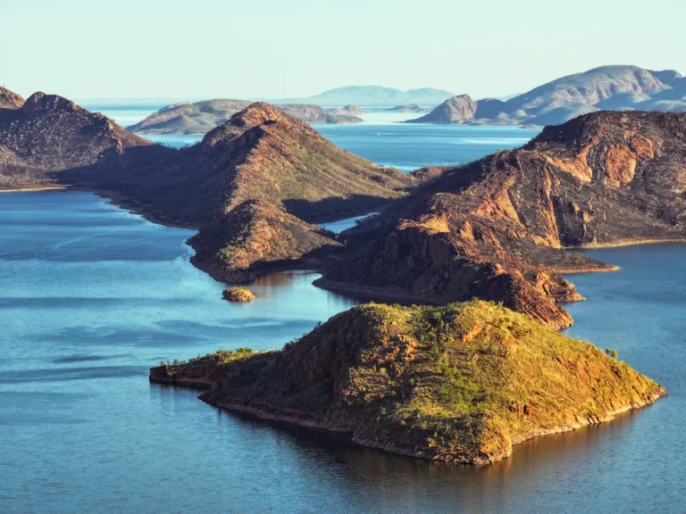 a lake with green islands