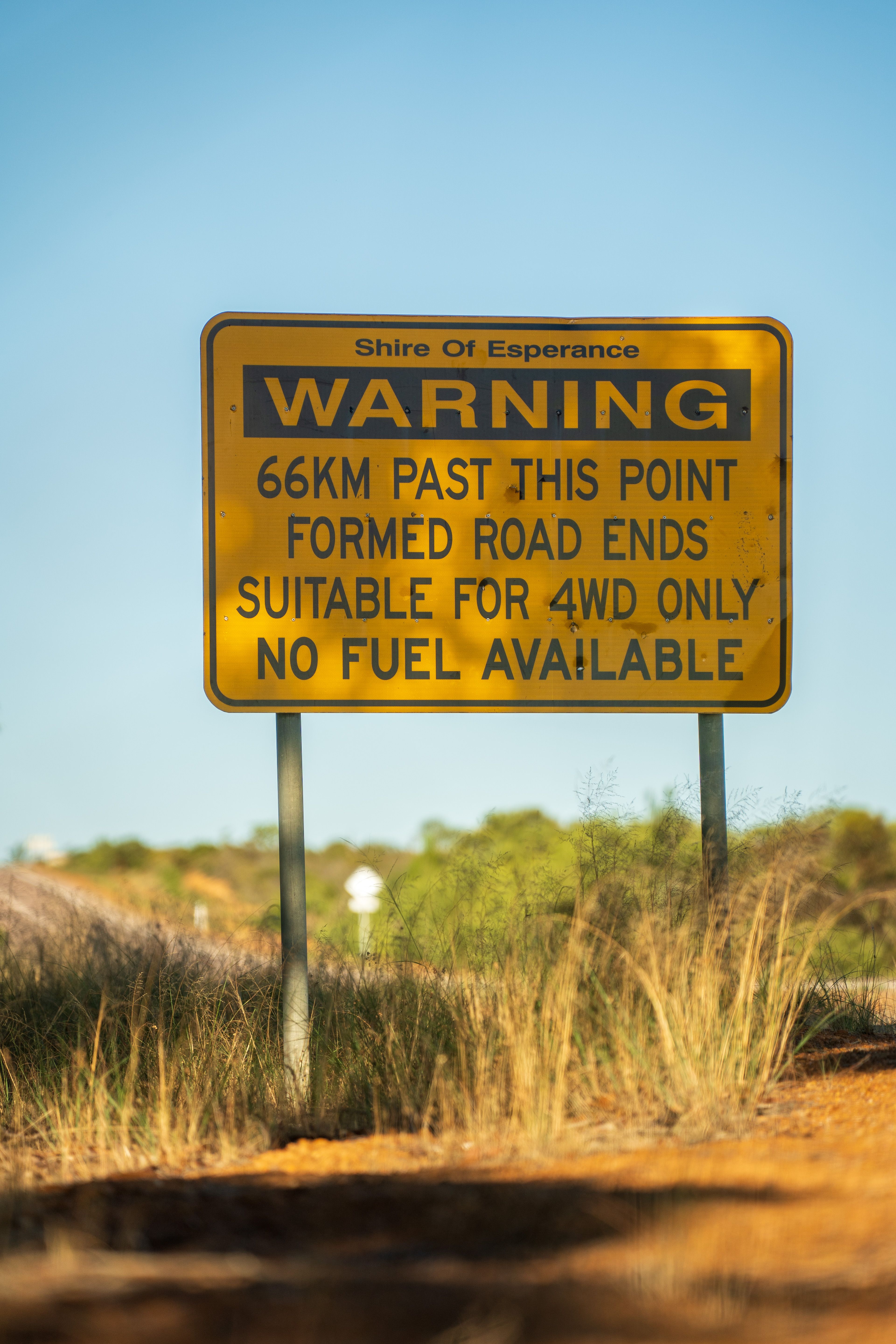 road sign warning of no fuel and 4WD only