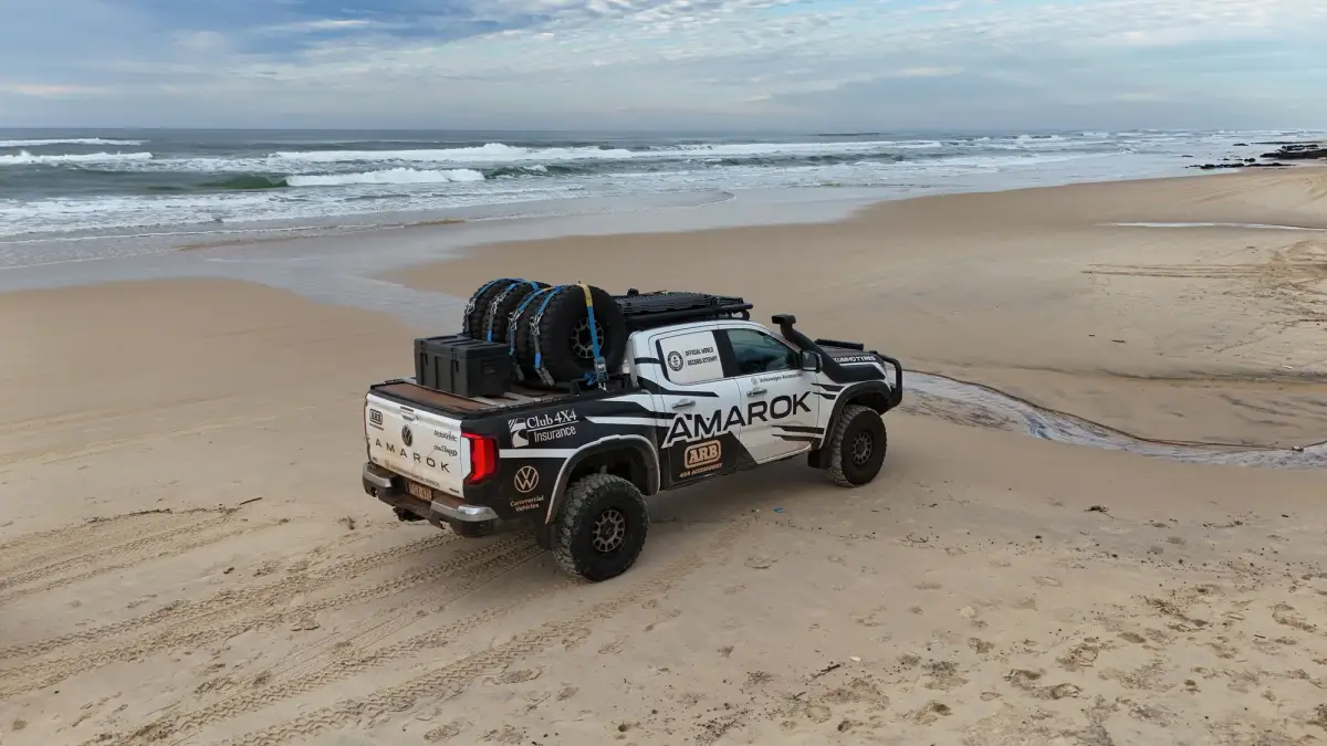 ariel image of volkswagen amarok on beach fraser island kgari