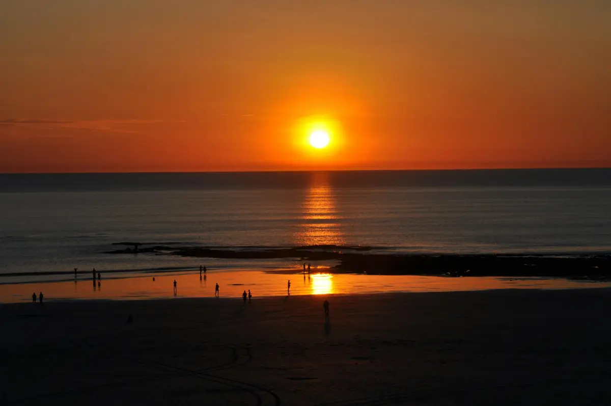 a sunset over a beach