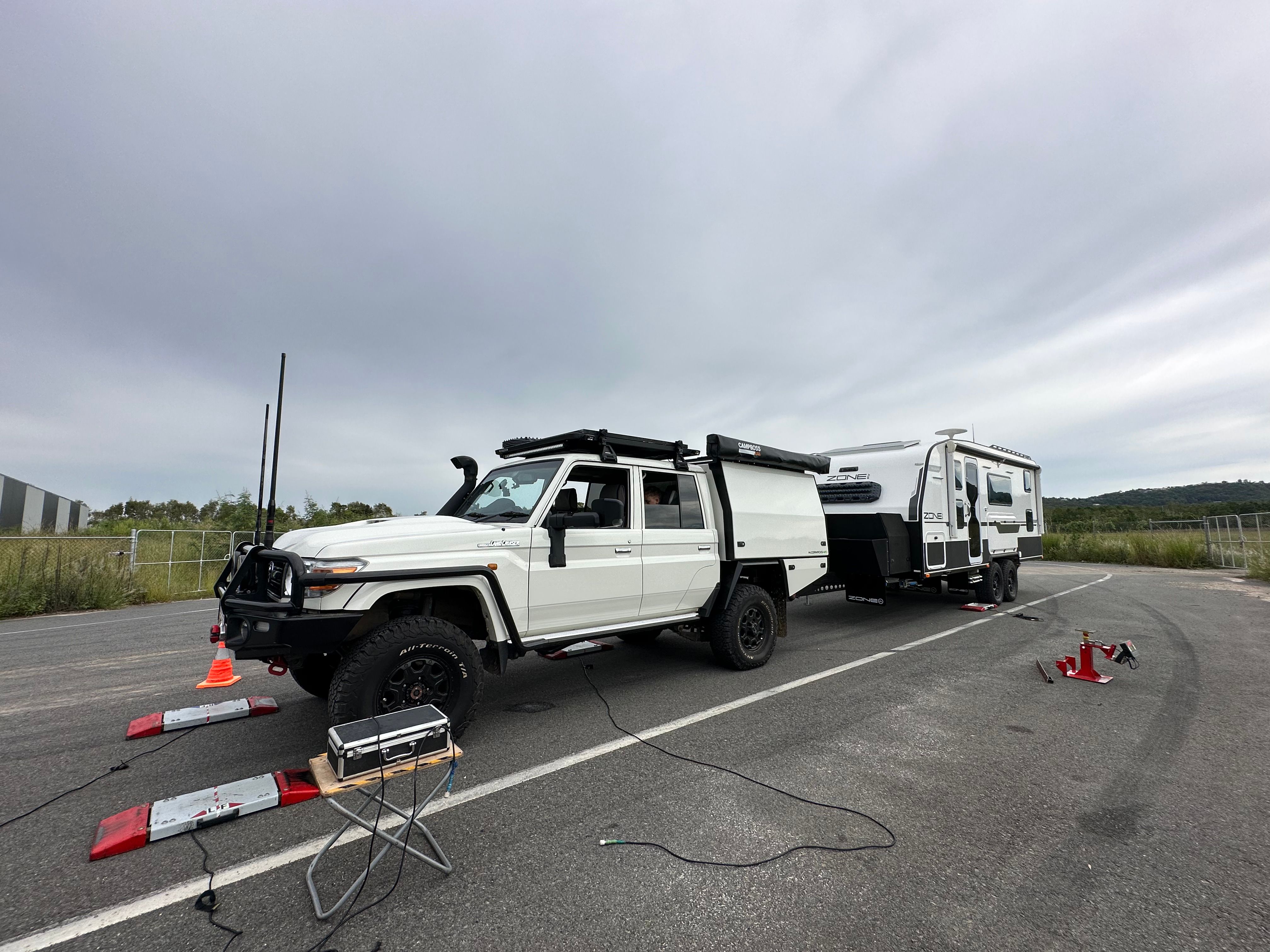 A Toyota LandCruiser and caravan being weighed