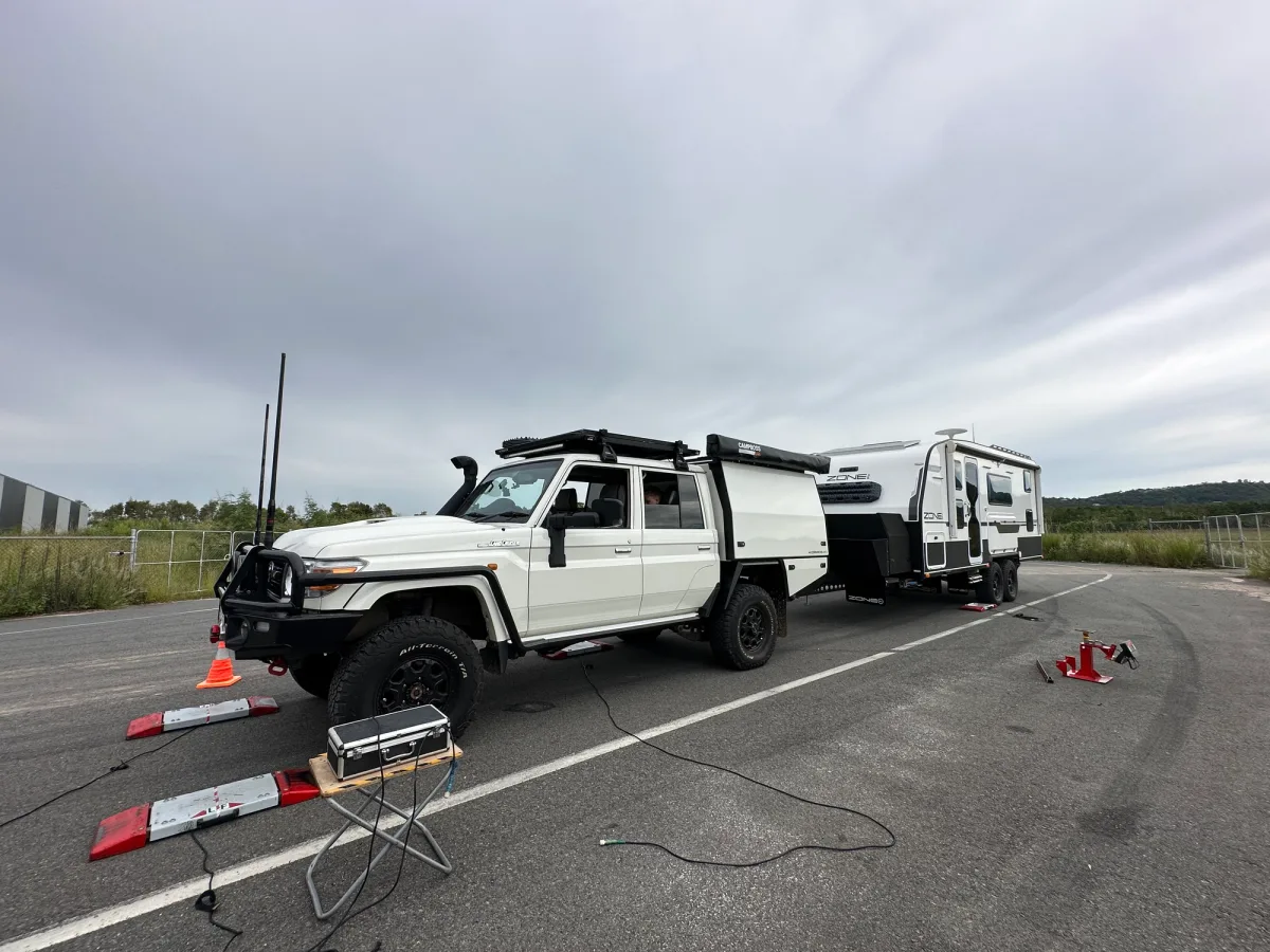A Toyota LandCruiser and caravan being weighed