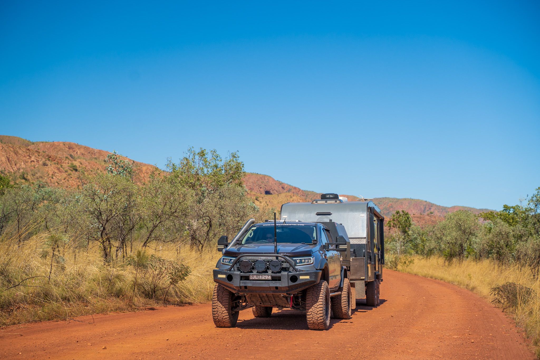 4x4 towing caravan through outback