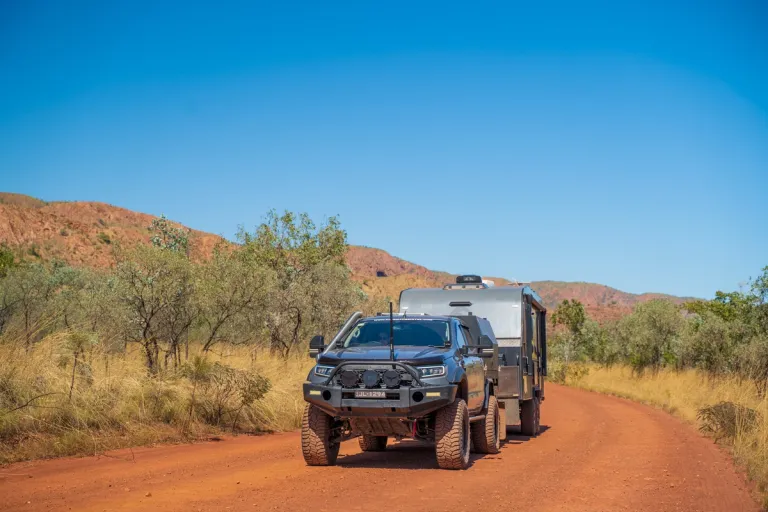 4x4 towing caravan through outback