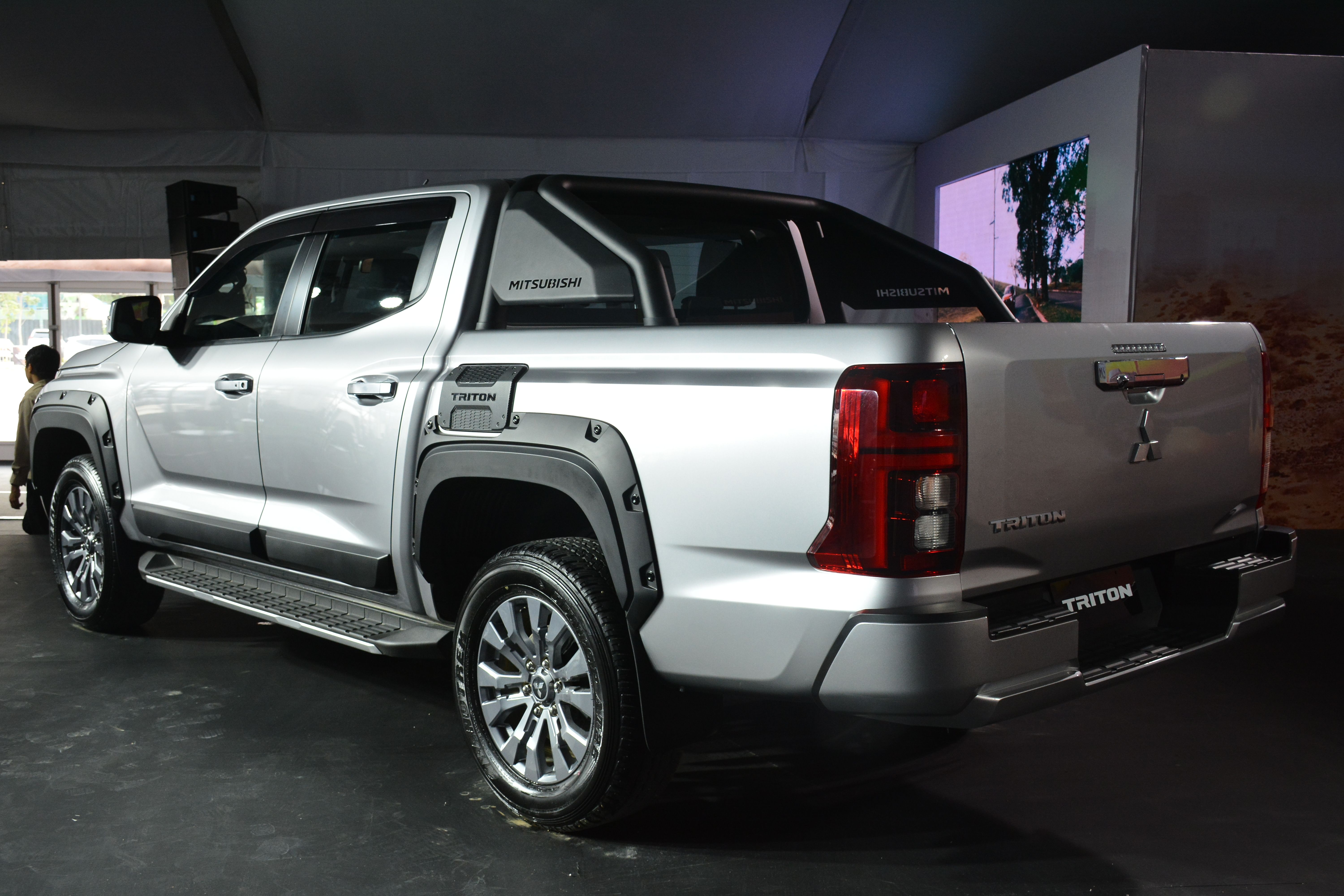 a mitsubishi trition in a showroom