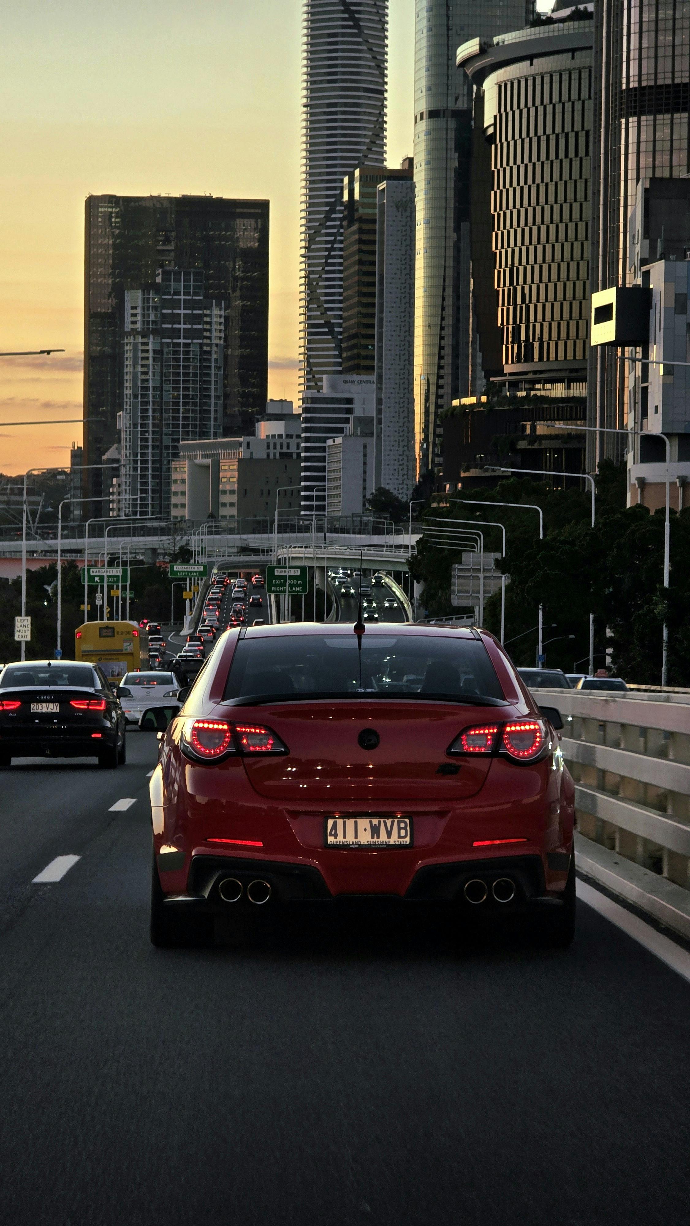 red Holden Commodore driving through Brisbane City