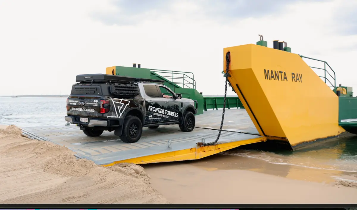 4WD on barge at Inskip Point
