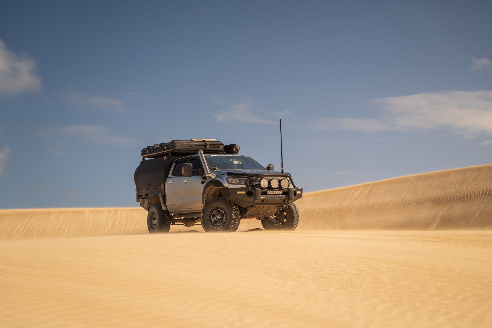A Ford Ranger on a sand dune in the Australian Outback