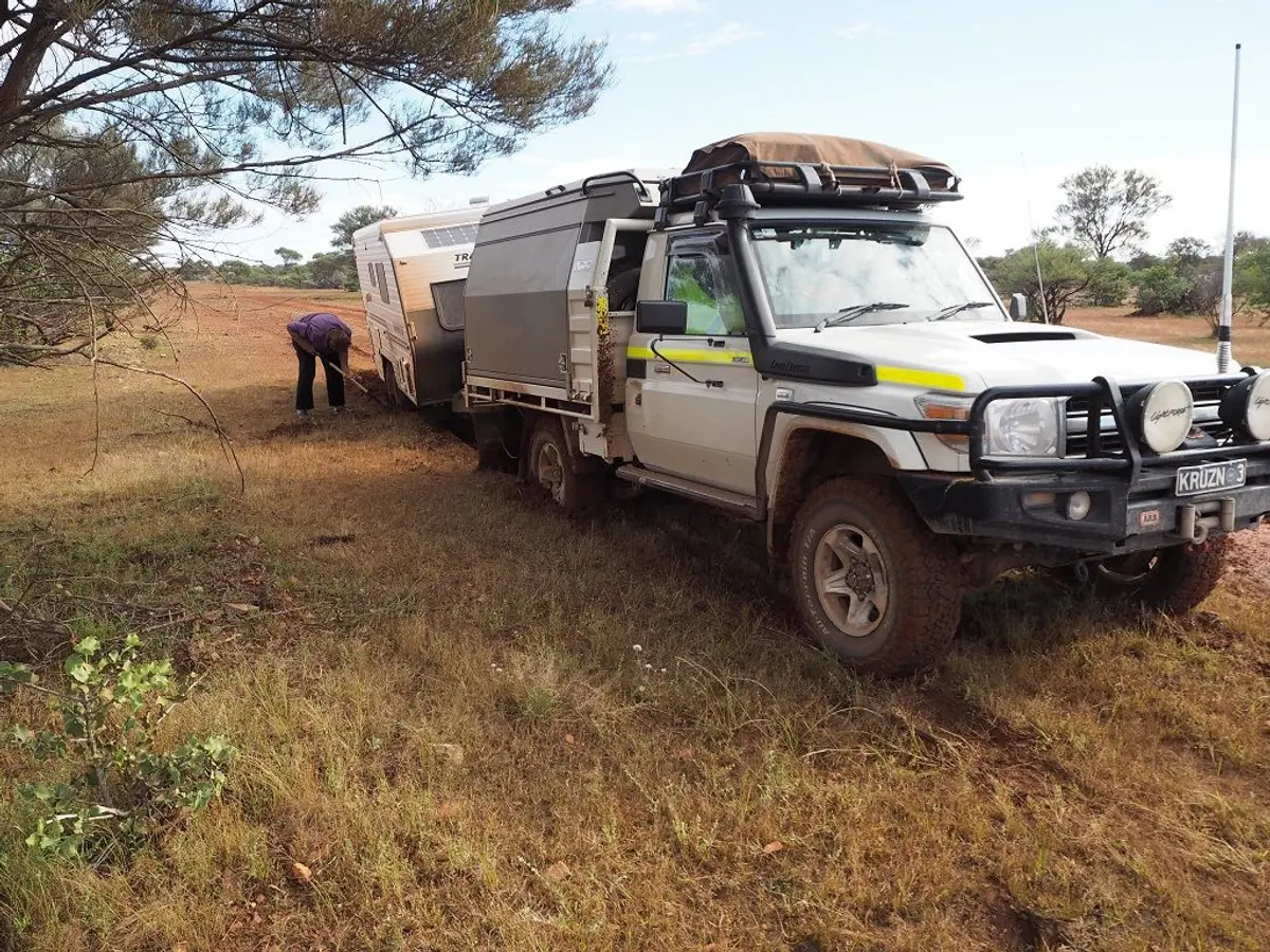 A bogged caravan in red soil