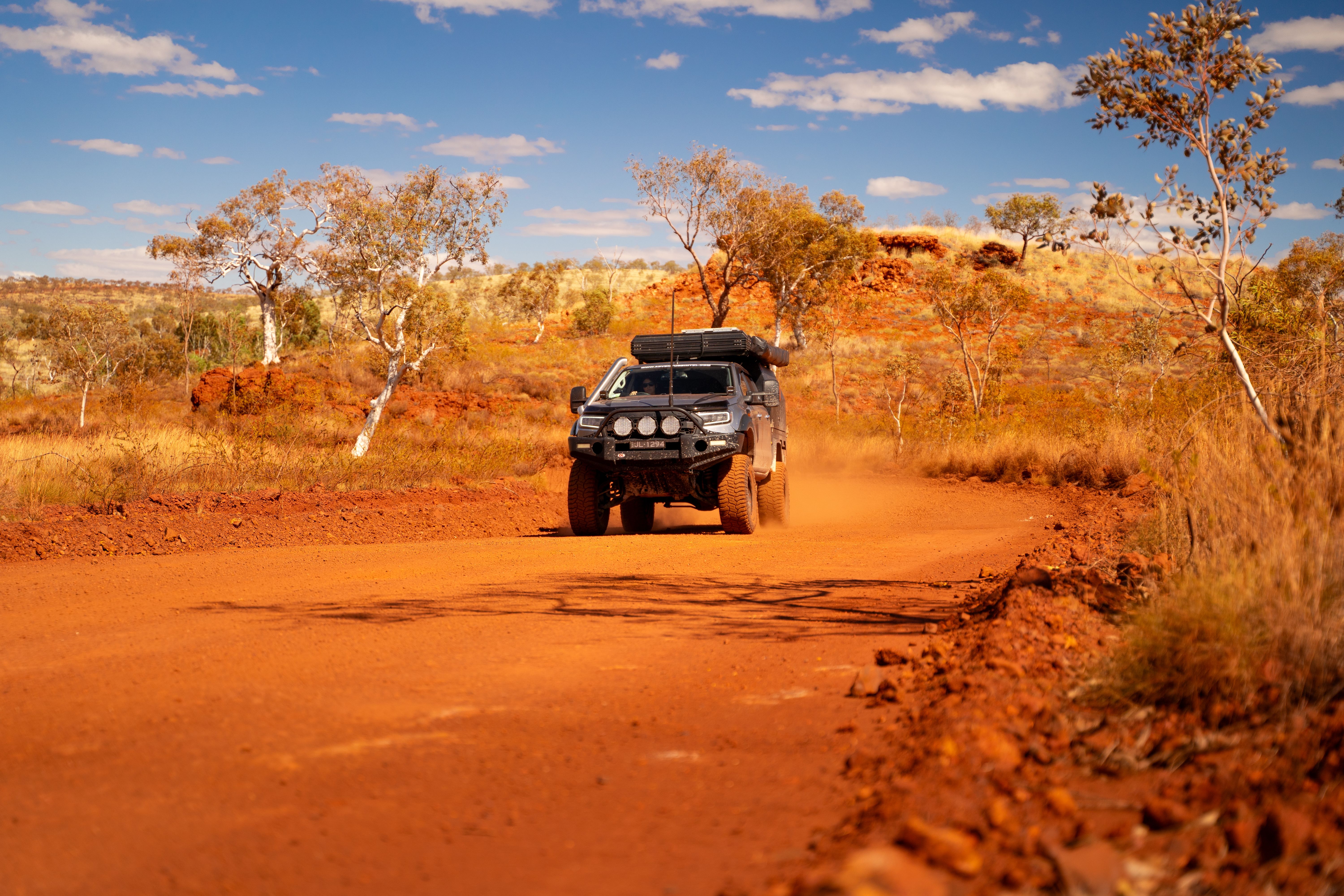 A 4X4 Ford Ranger travelling through a dusty road in Australia's outback