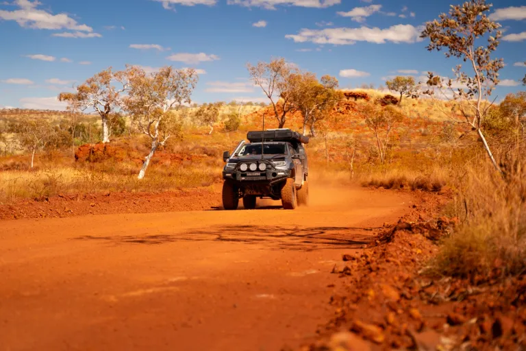 A 4X4 Ford Ranger travelling through a dusty road in Australia's outback