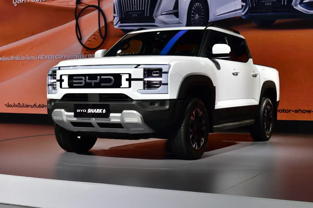 A white BYD Shark 6 in a showroom