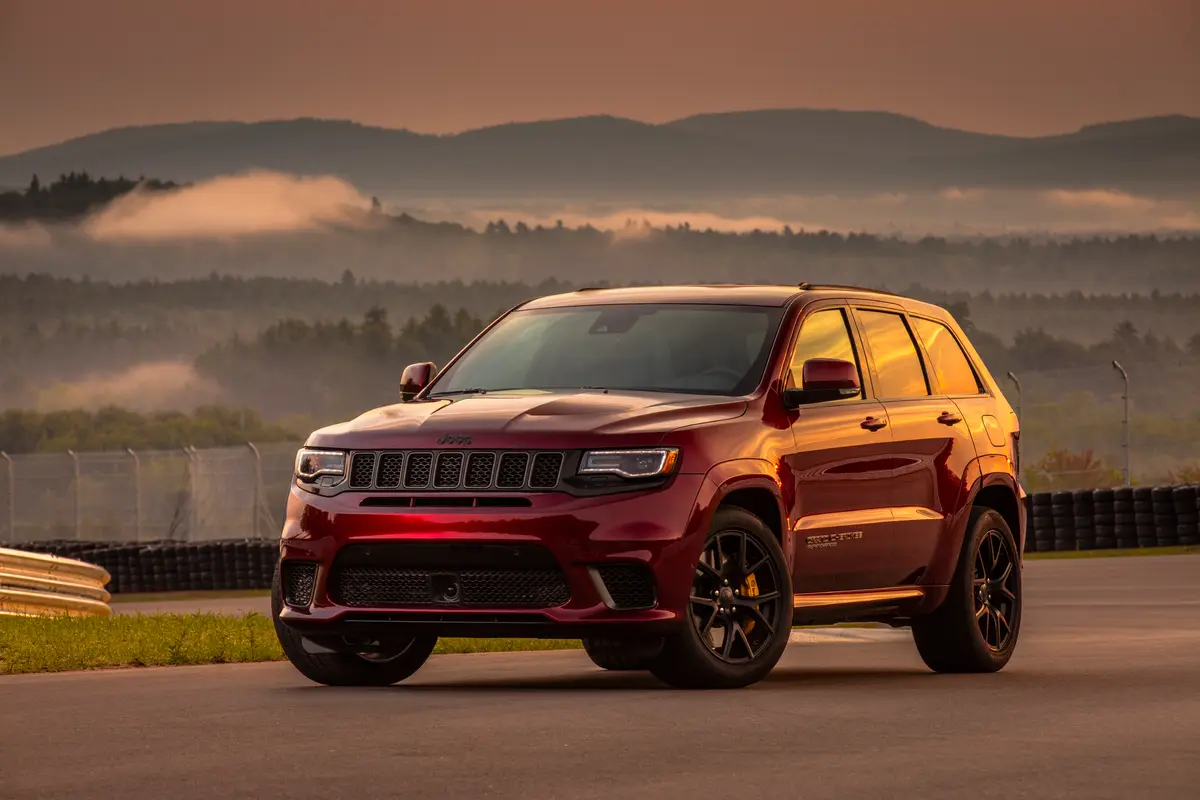 A red Jeep Grand Cherokee Trackhawk during sunset