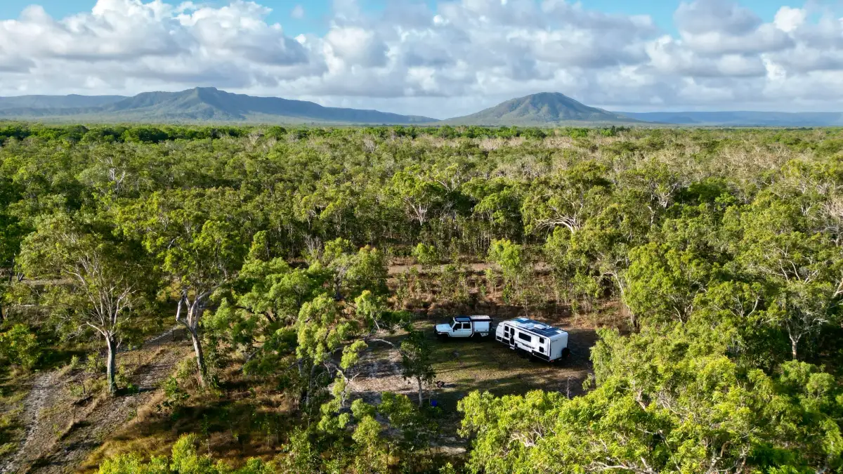 Toyota Landcruiser and a caravan in a remote camp in Cooktown