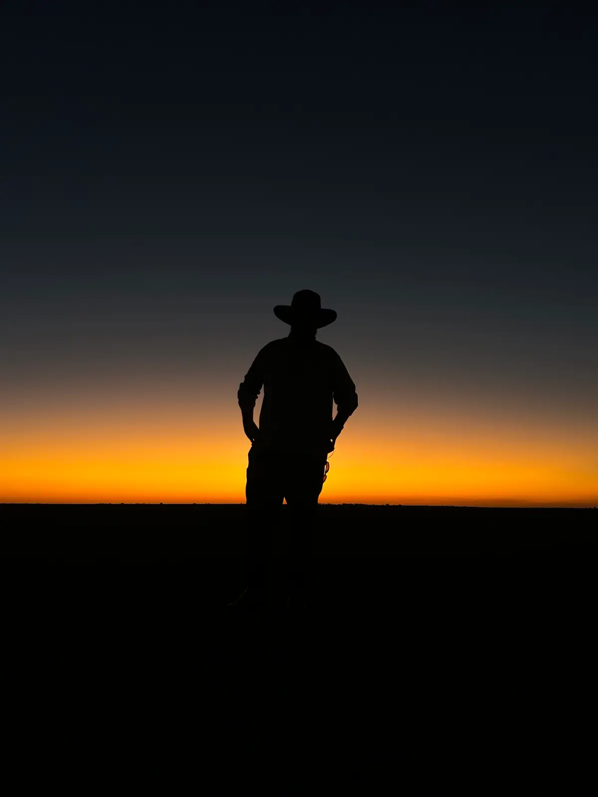 sunset on the salt pan with man's silhouette