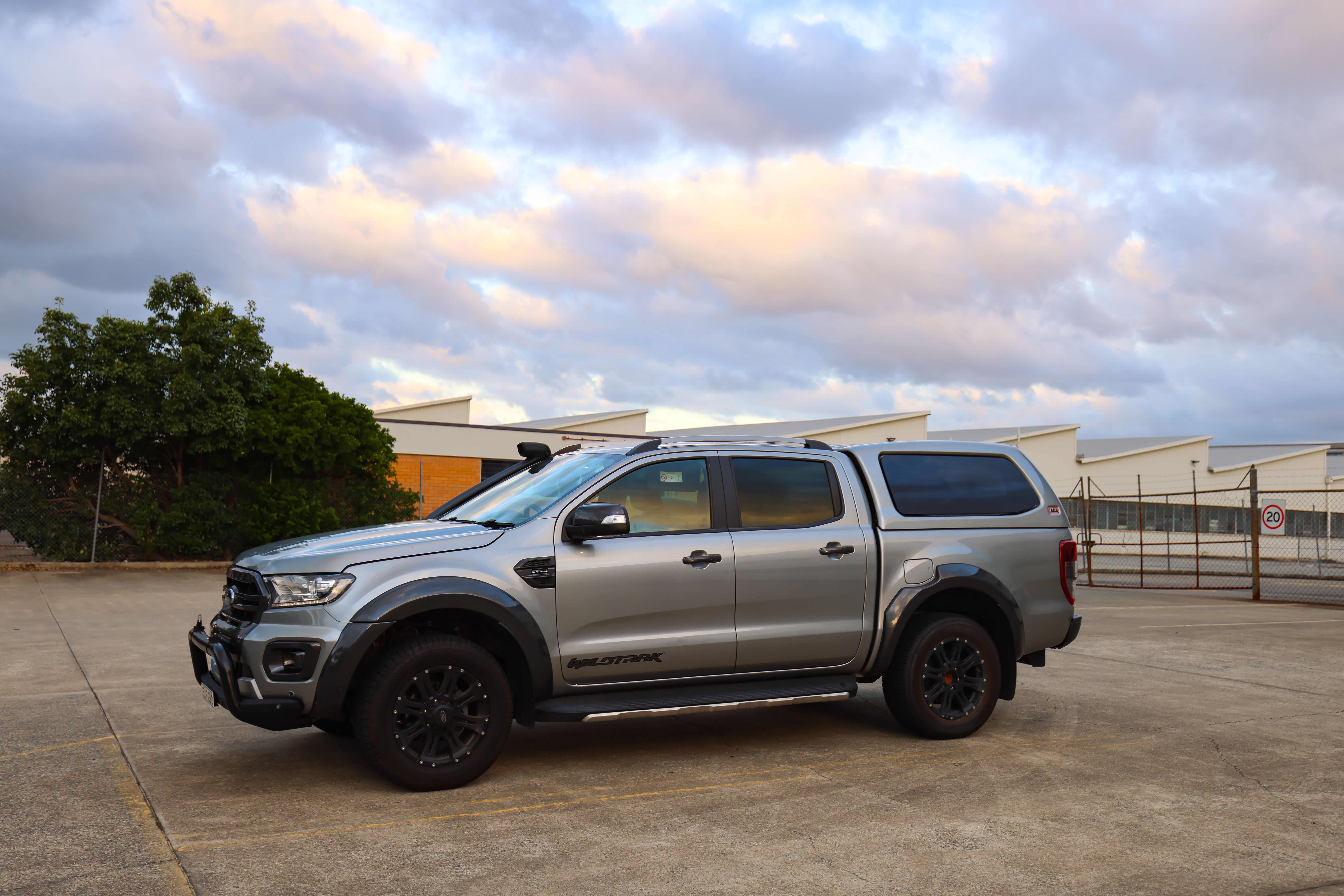 ford ranger 4x4 sitting in an industrial lot under cloudy sky