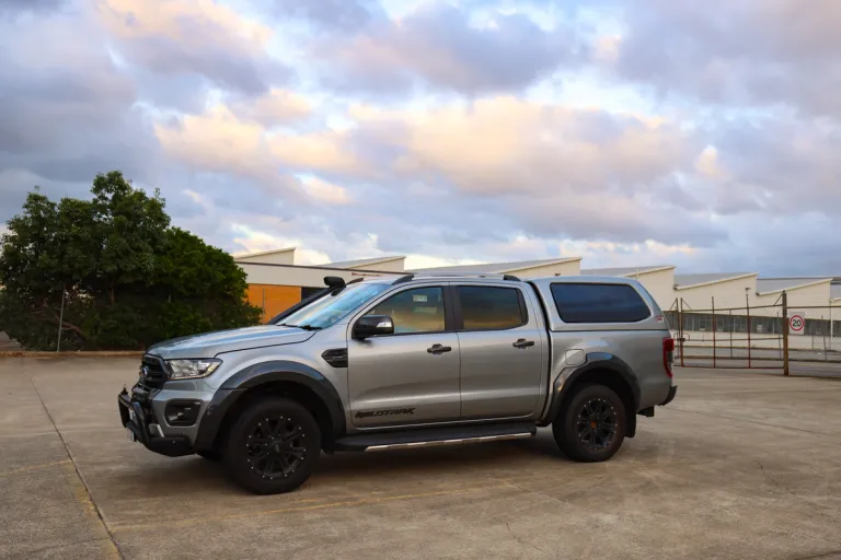 ford ranger 4x4 sitting in an industrial lot under cloudy sky