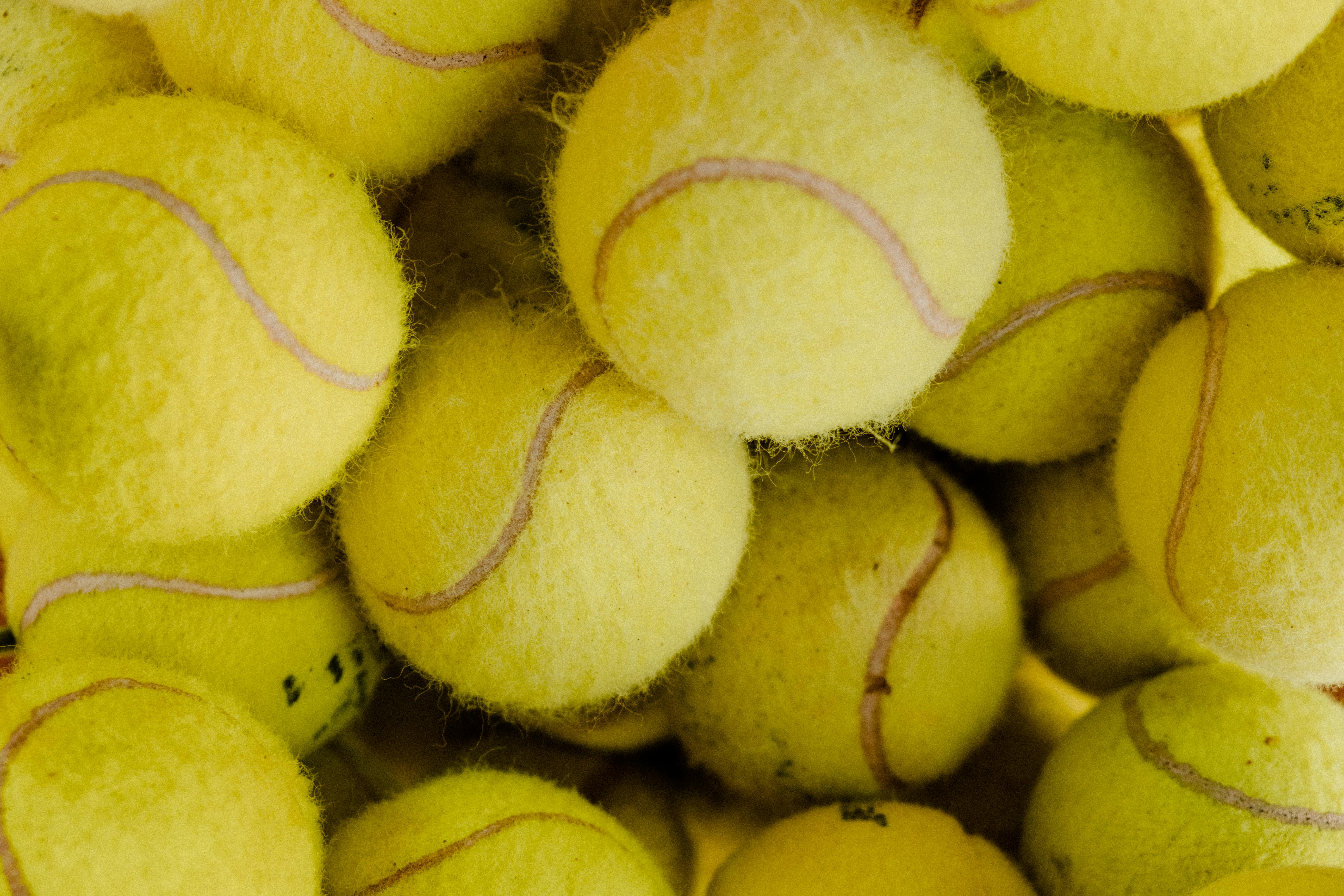 a bunch of tennis balls close-up