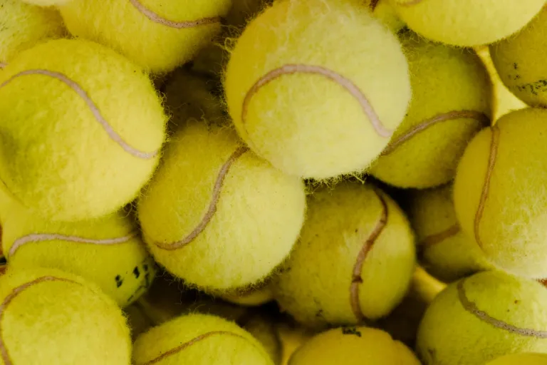 a bunch of tennis balls close-up