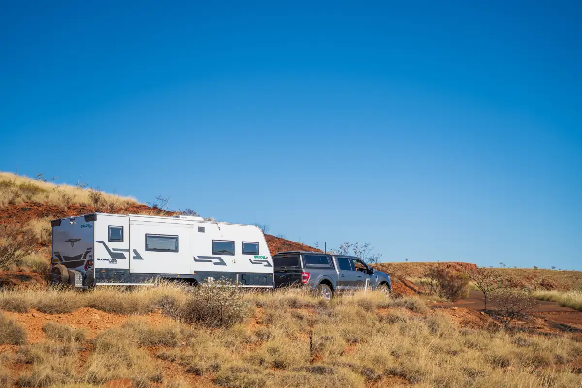 A 4X4 and caravan in the Outback