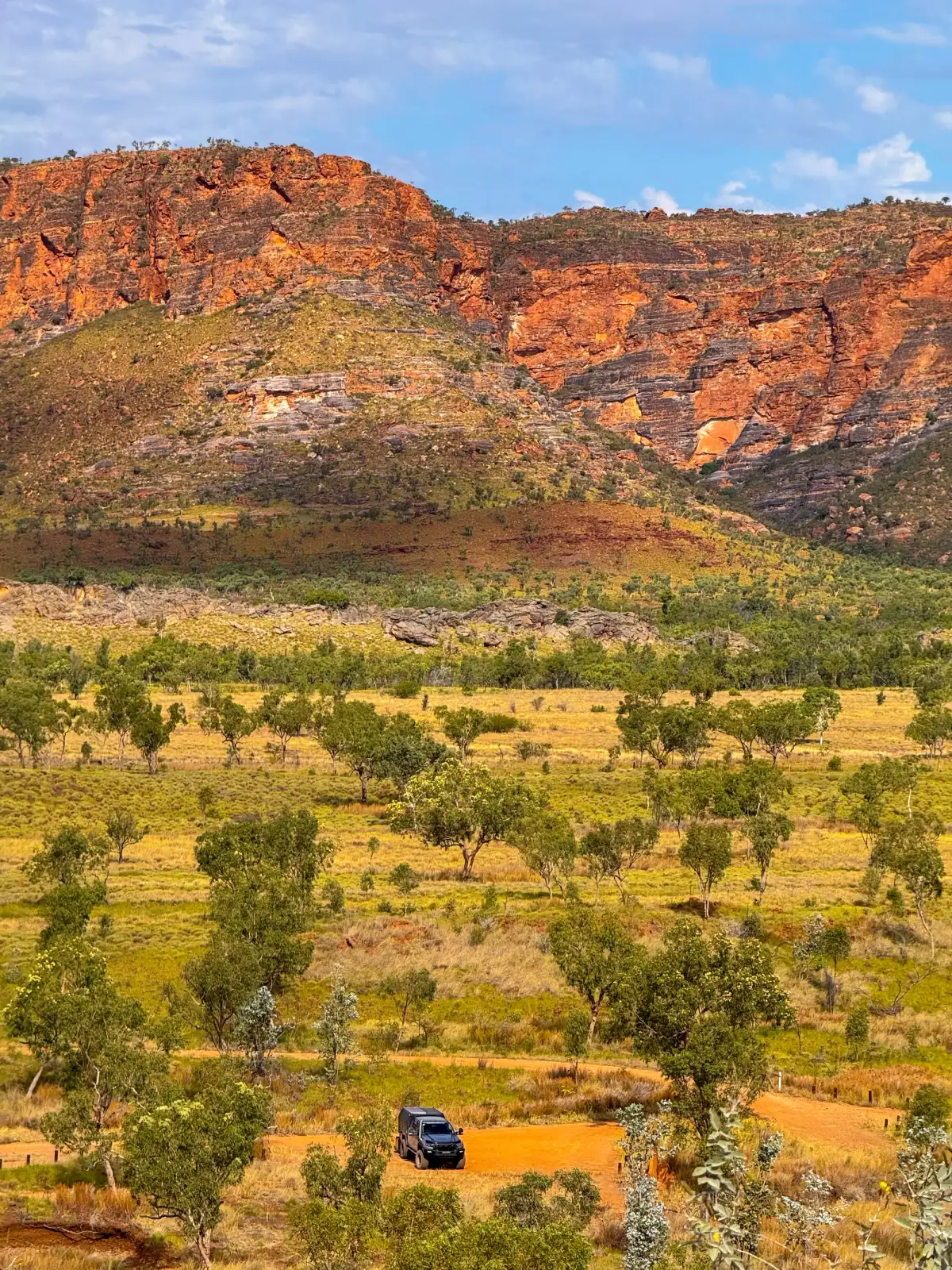 4x4 and caravan parked in front of mountain range