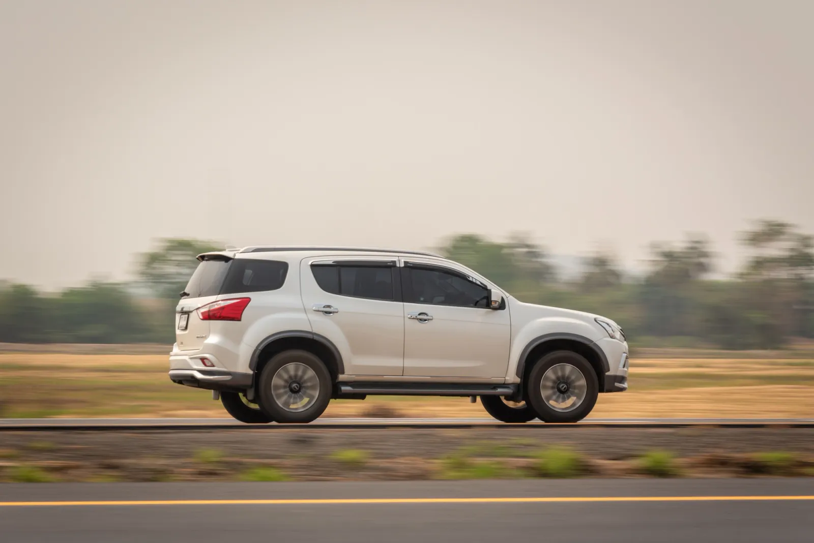 4x4 suv driving on road at speed