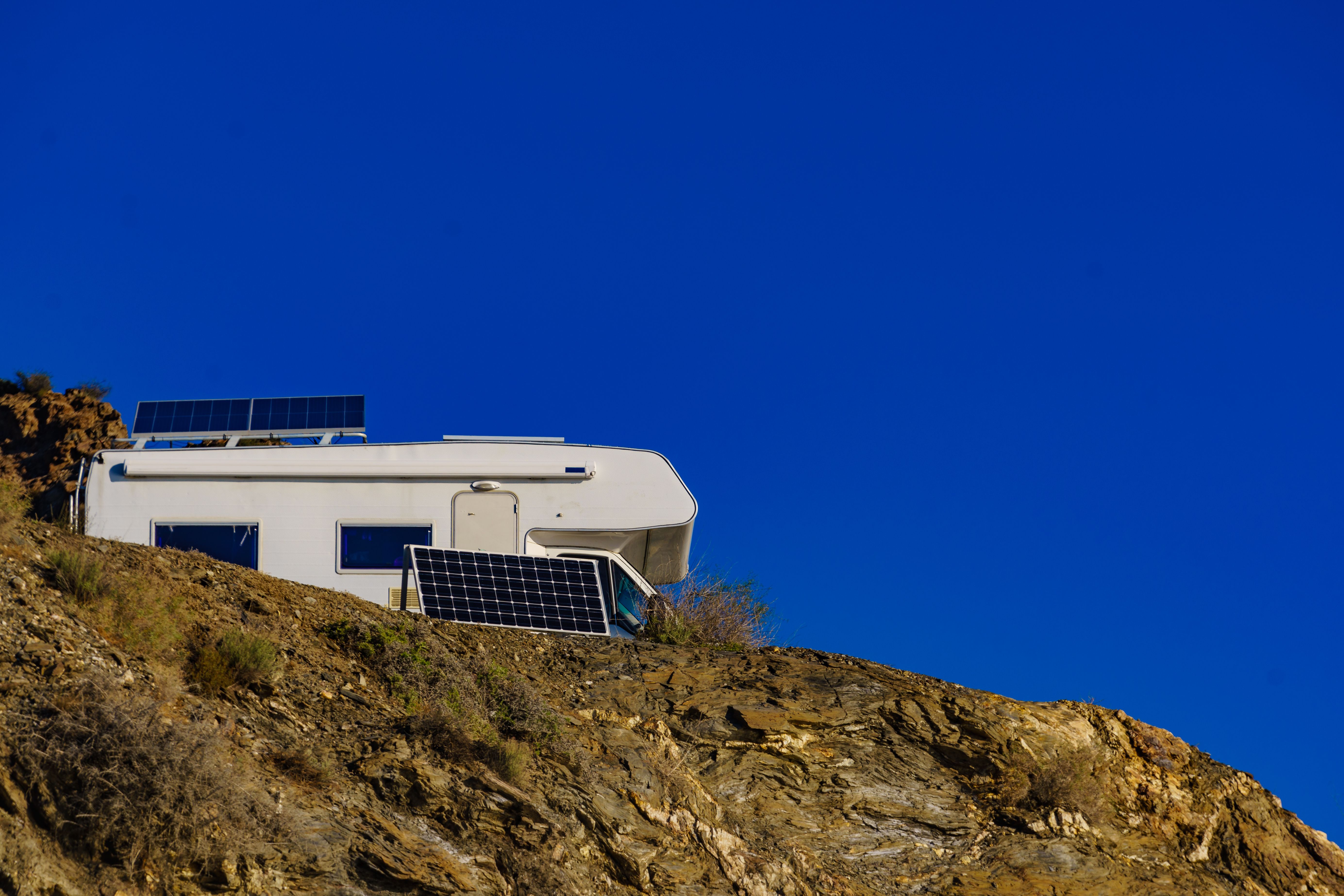 rv on a cliff with solar setup