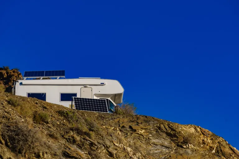rv on a cliff with solar setup