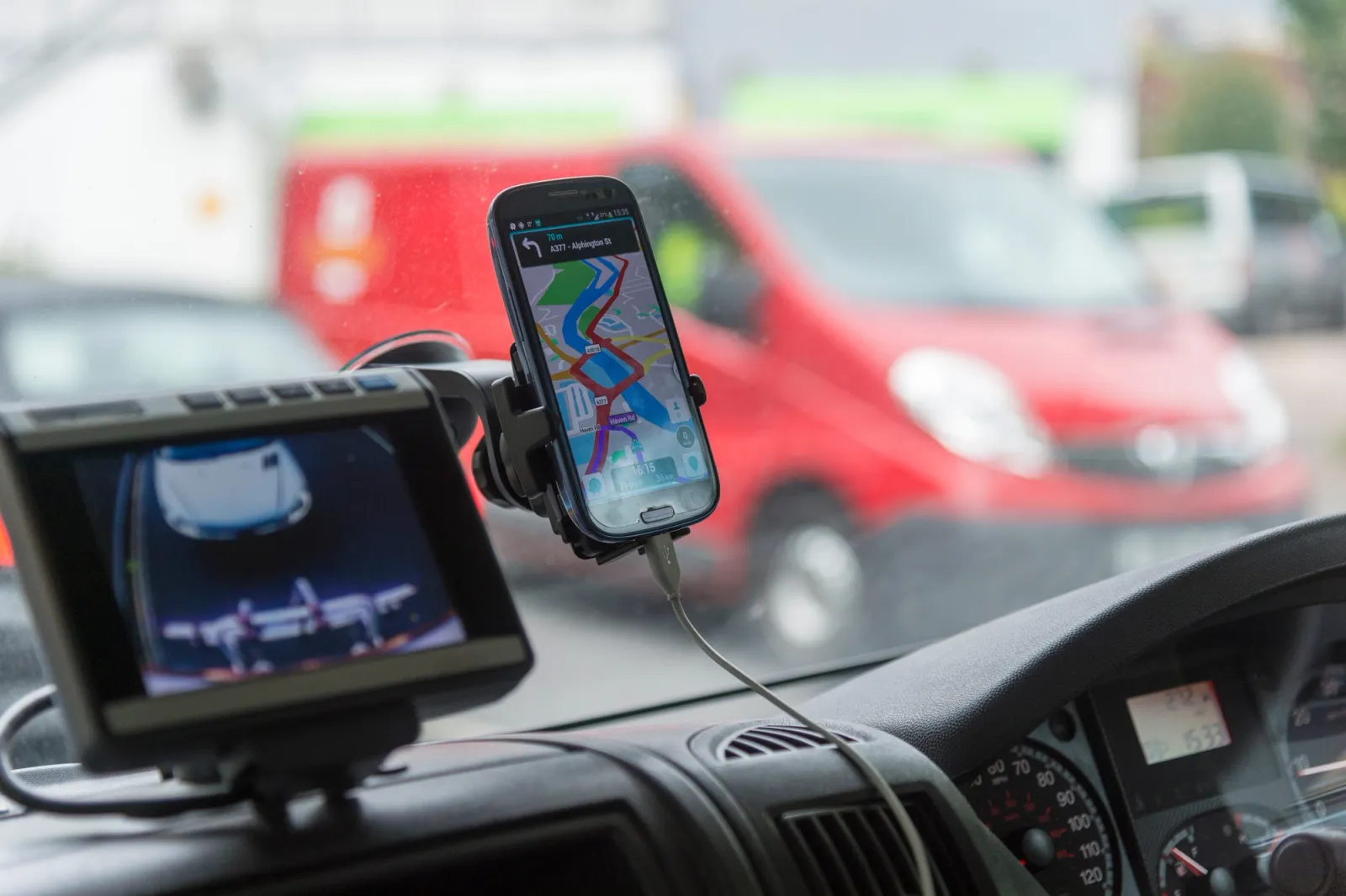 phone and camera on dash of vehicle