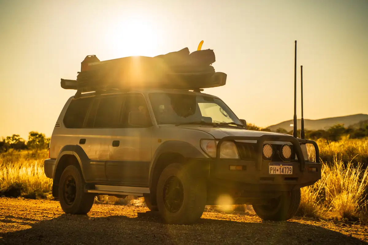 A 4WD Toyota in Australia with the sun in the background
