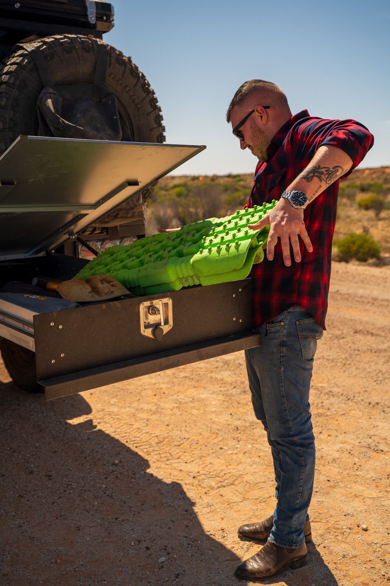 Josh Leonard removing a recovery board from a drawer