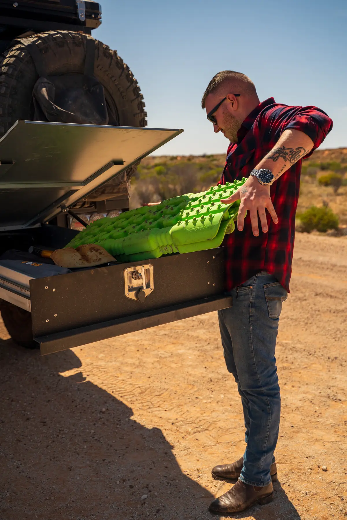 Josh Leonard removing a recovery board from a drawer