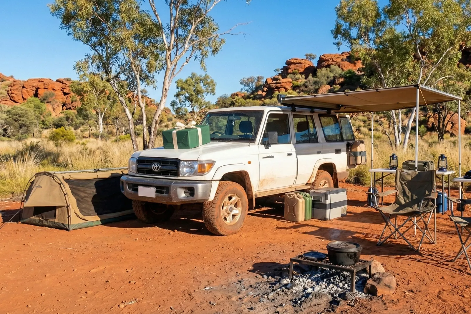A campsite with a present on the bonnet of a 4WD