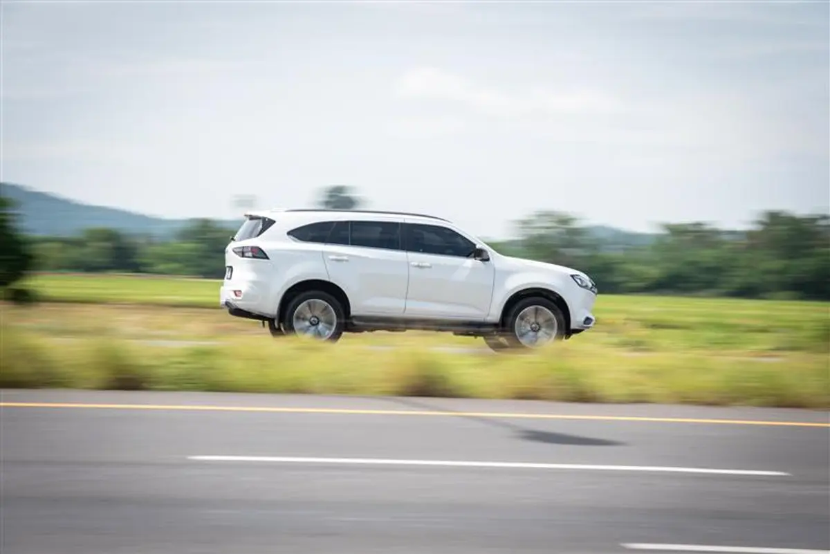 SUV driving on highway with motion blur