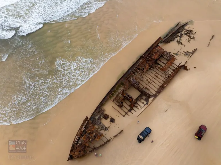 maheno shipwreck birds eye drone with 4wds on beach
