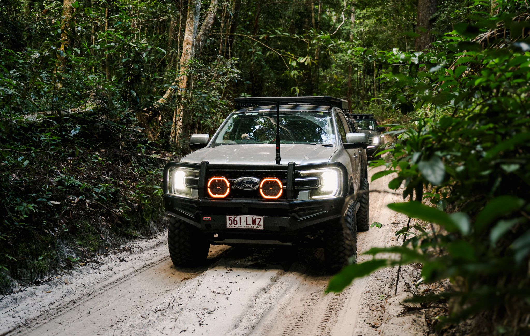 4WD driving through K'Gari's rainforest