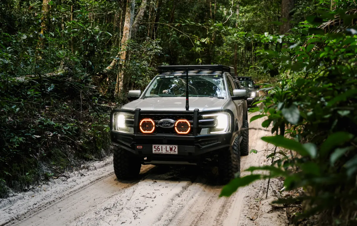 4WD driving through K'Gari's rainforest