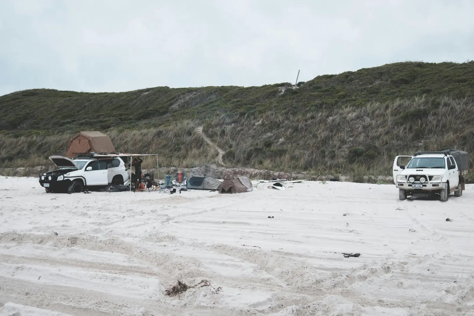 2 4X4s parked at camp on a beach in Australia