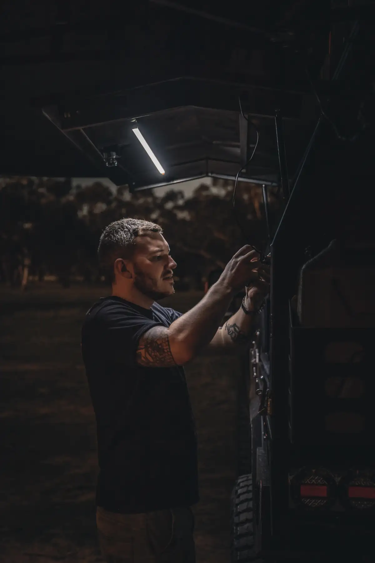 Josh Leonard under the light of his 4X4 Ford Ranger's canopy