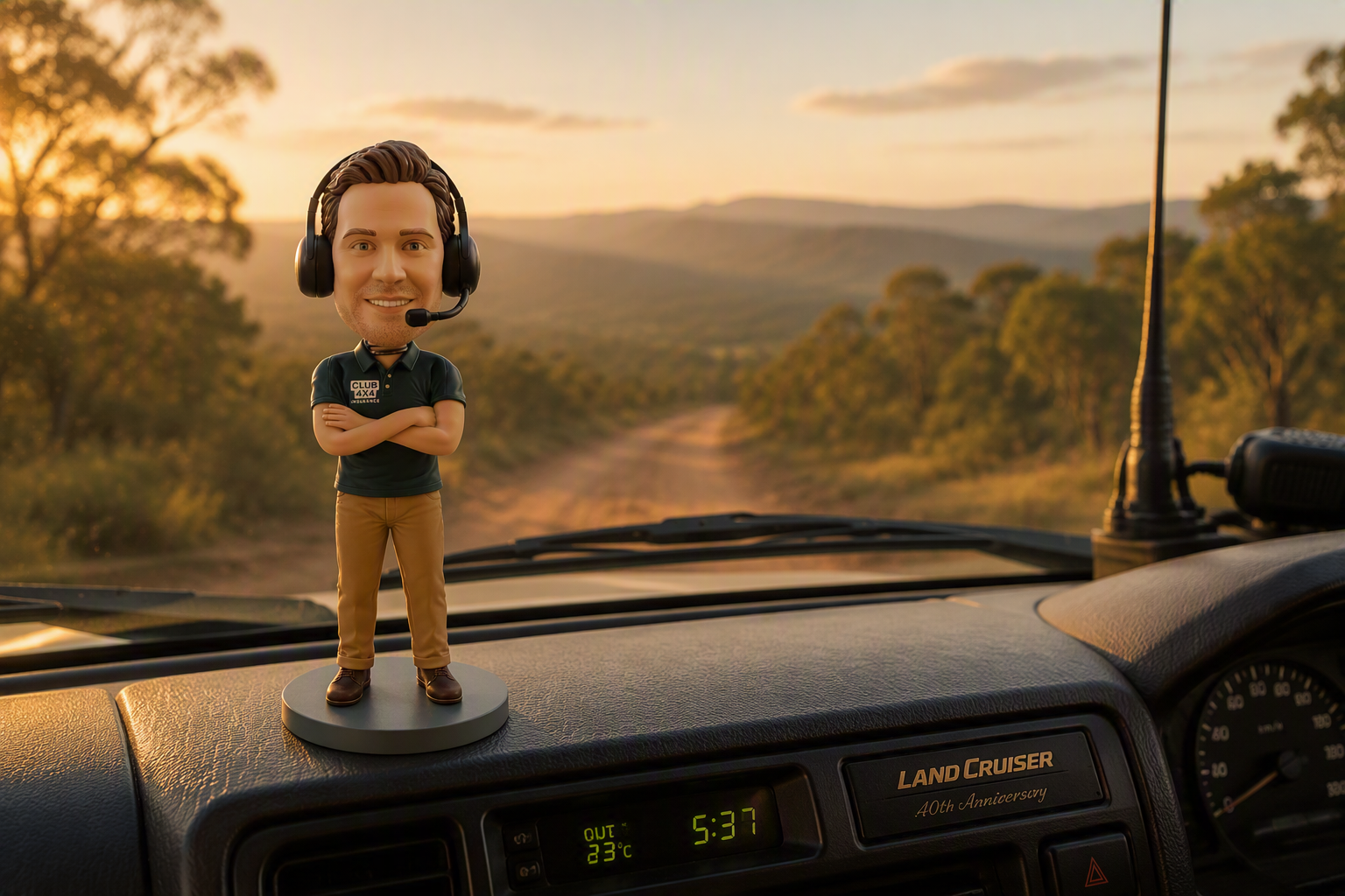A bobblehead with a Ford Ranger in the background