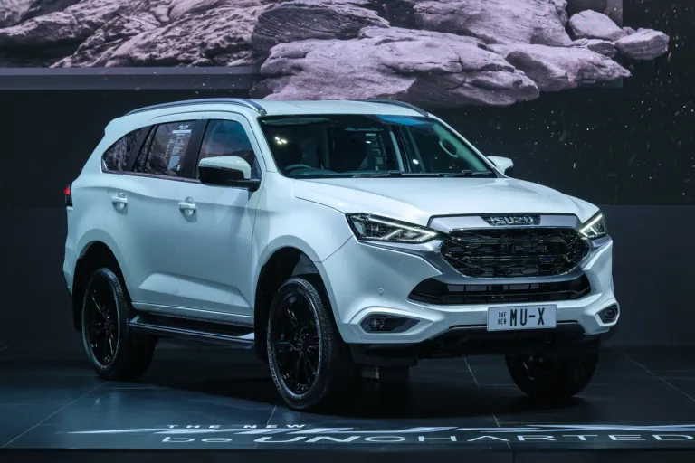 white 4x4 suv in a showroom